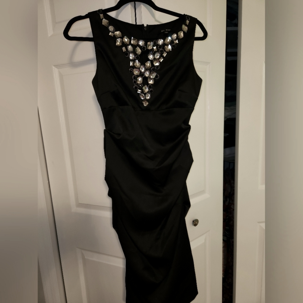 Black cinched knee length dress with rhinestones..never worn